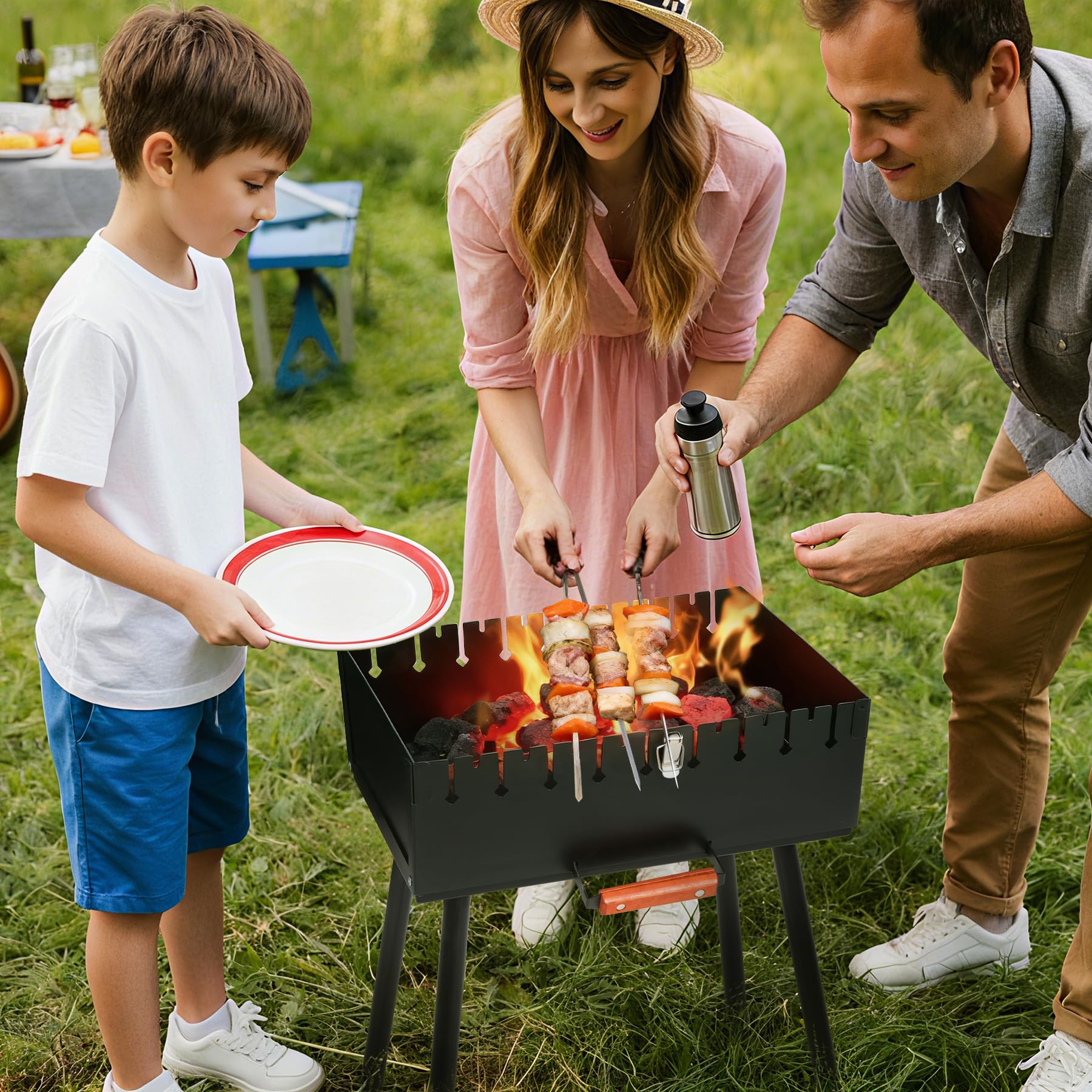 REDCAMP portable charcoal grill with skewers family using the grill outdoors